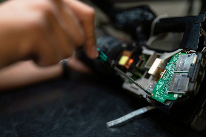 Medical equipment repair Biomedical engineer repairing medical equipment working on circuit board